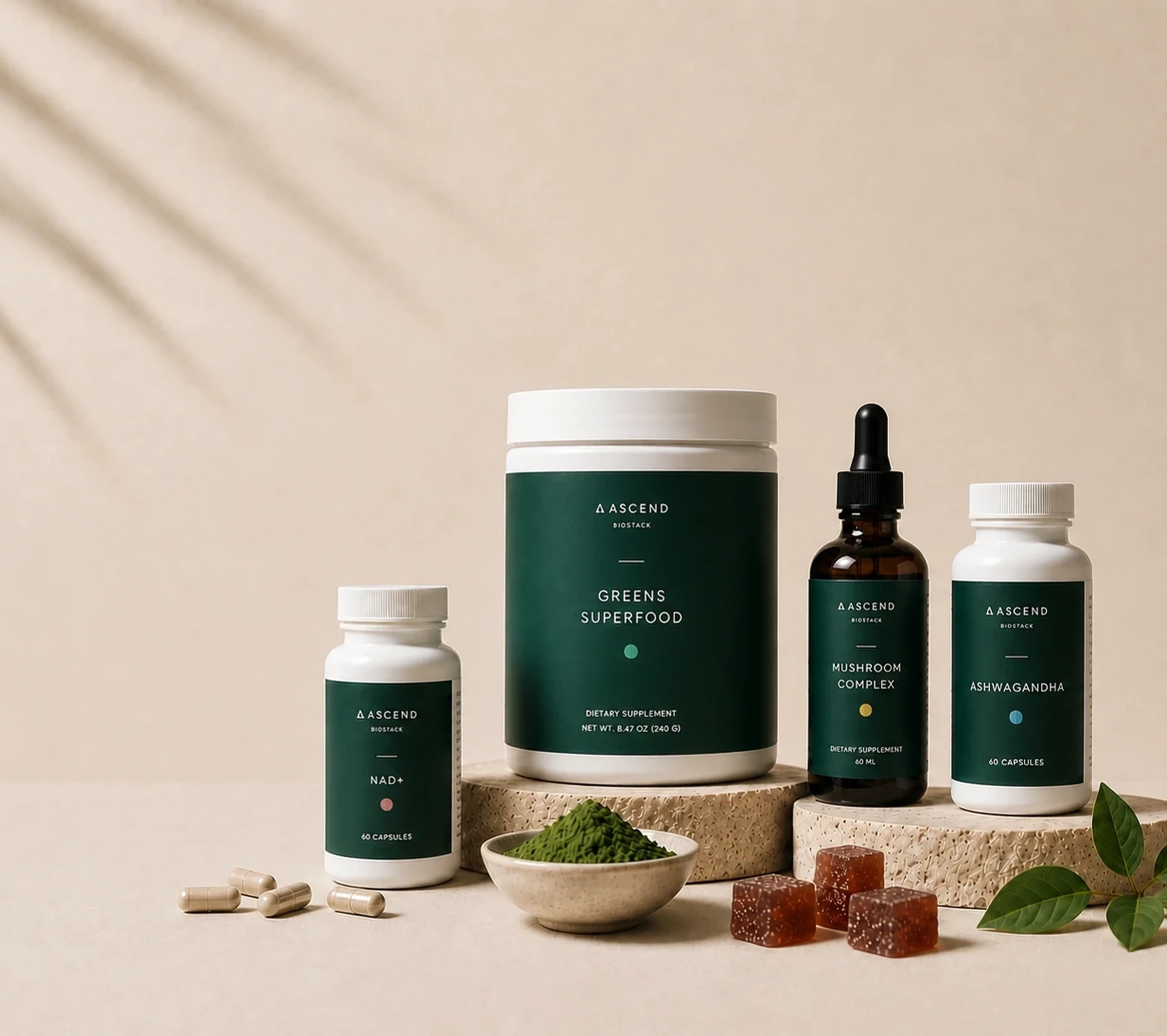 Ascend BioStack supplements arranged on warm stone plinths